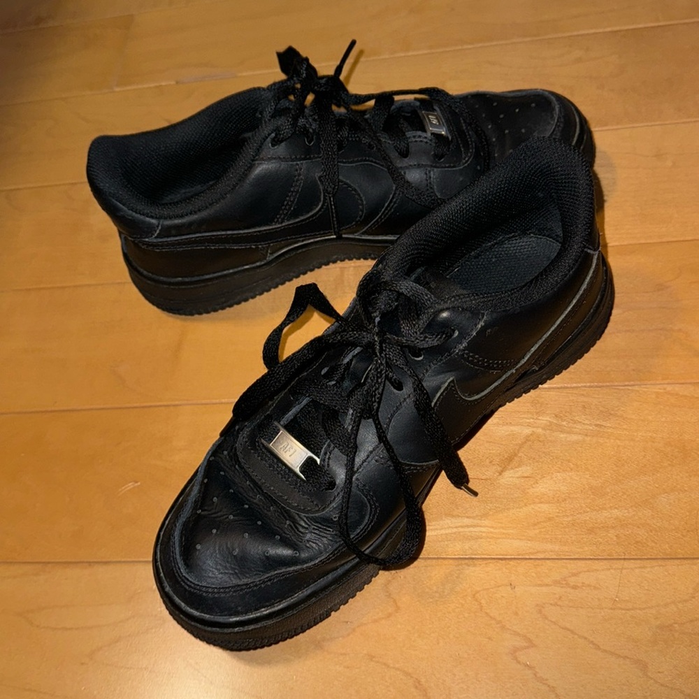 All black nike air force 1 sneakers
